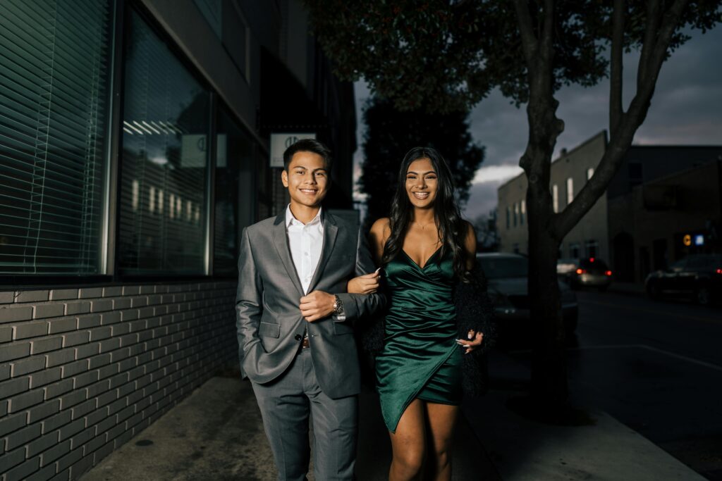Confident young people exchanging smiles in a warm, casual setting, symbolizing how flirting boosts self-esteem.